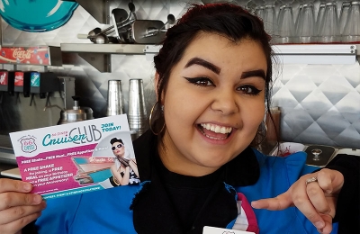 STaff holding a cruiser club card